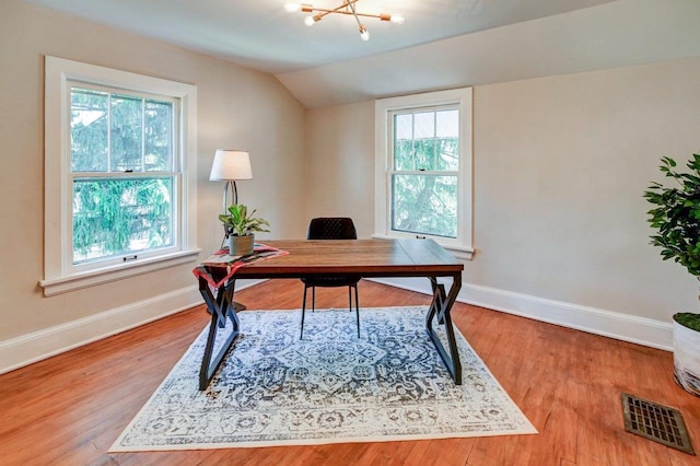 3112 Monroe St, Madison, WI 53711 - home office with plenty of natural light, baseboards, lofted ceiling, a chandelier, and wood finished floors