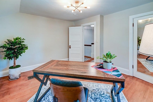 3112 Monroe St, Madison, WI 53711 - home office featuring a chandelier, wood finished floors, and baseboards
