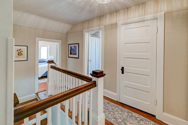 3112 Monroe St, Madison, WI 53711 - hall featuring wood finished floors, an upstairs landing, vaulted ceiling, and baseboards
