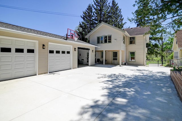 3112 Monroe St, Madison, WI 53711 - view of front of home with fence, an outbuilding, and a garage