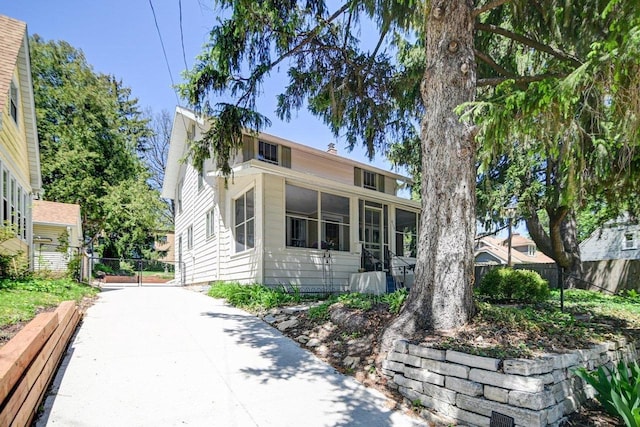 3112 Monroe St, Madison, WI 53711 - view of front of property featuring a sunroom and fence