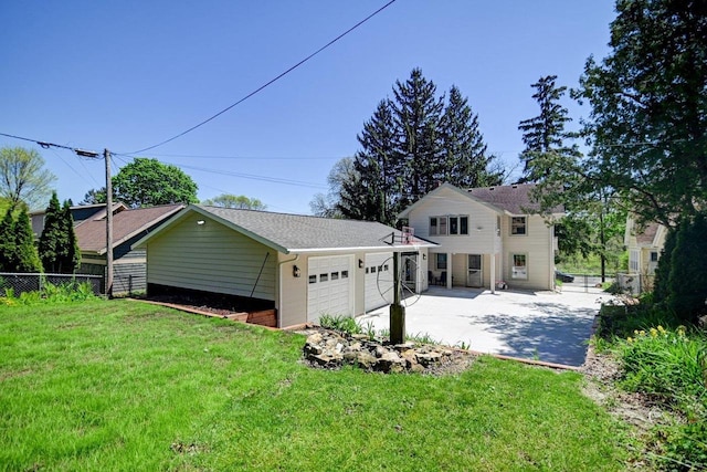 3112 Monroe St, Madison, WI 53711 - back of house featuring a garage and driveway