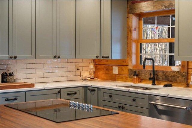 744 50th Ave, Clear Lake, WI 54005 - kitchen featuring stainless steel dishwasher, black electric cooktop, gray cabinetry, and decorative backsplash