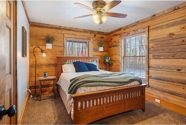 744 50th Ave, Clear Lake, WI 54005 - carpeted bedroom with wooden walls, multiple windows, baseboards, and a ceiling fan