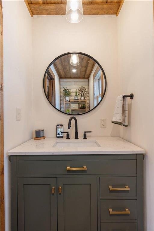 744 50th Ave, Clear Lake, WI 54005 - bathroom with wooden ceiling and vanity