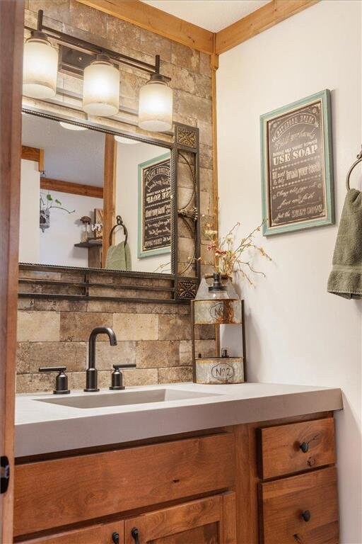 744 50th Ave, Clear Lake, WI 54005 - bathroom with decorative backsplash and vanity