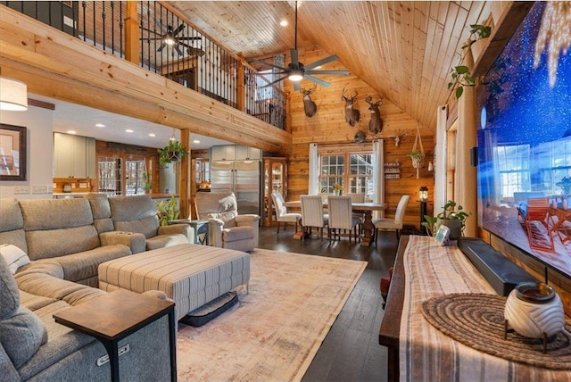 744 50th Ave, Clear Lake, WI 54005 - living room with high vaulted ceiling, wooden walls, wood ceiling, a ceiling fan, and wood-type flooring