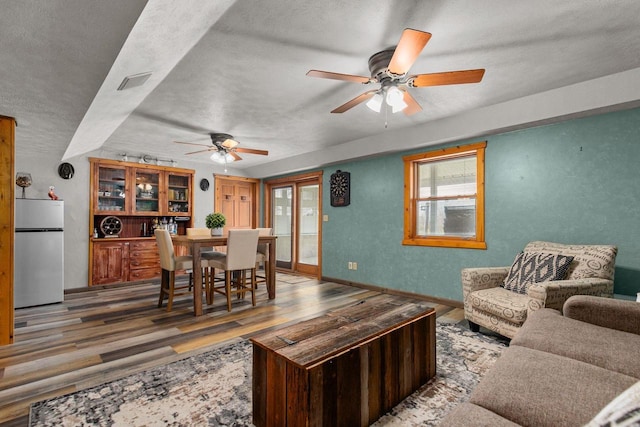 W3161 Julianna Ct, Chilton, WI 53014 - living area featuring ceiling fan, wood finished floors, a textured ceiling, and baseboards