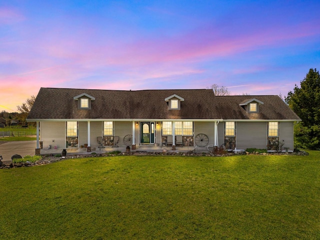 W3161 Julianna Ct, Chilton, WI 53014 - back of house at dusk featuring a yard, a shingled roof, and a porch