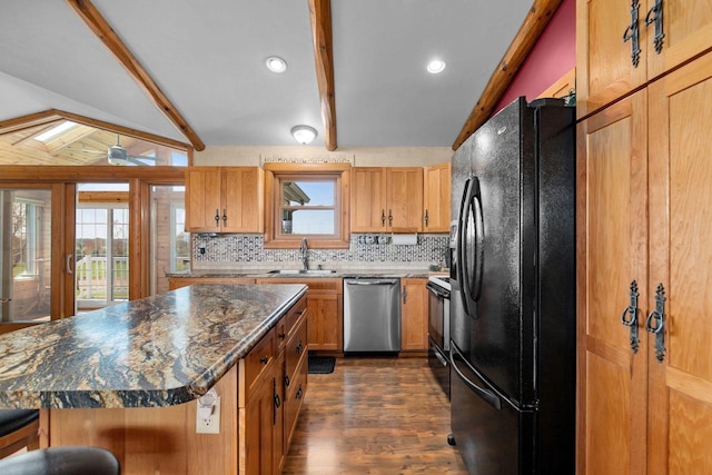 W3161 Julianna Ct, Chilton, WI 53014 - kitchen featuring black fridge with ice dispenser, stainless steel dishwasher, a sink, range, and tasteful backsplash