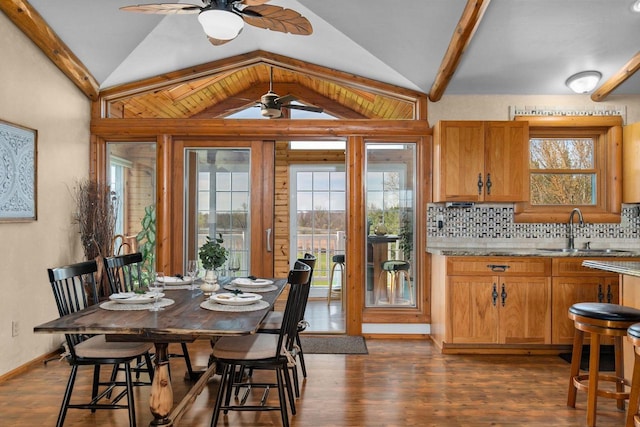 W3161 Julianna Ct, Chilton, WI 53014 - dining space featuring ceiling fan, lofted ceiling, dark wood-type flooring, and baseboards