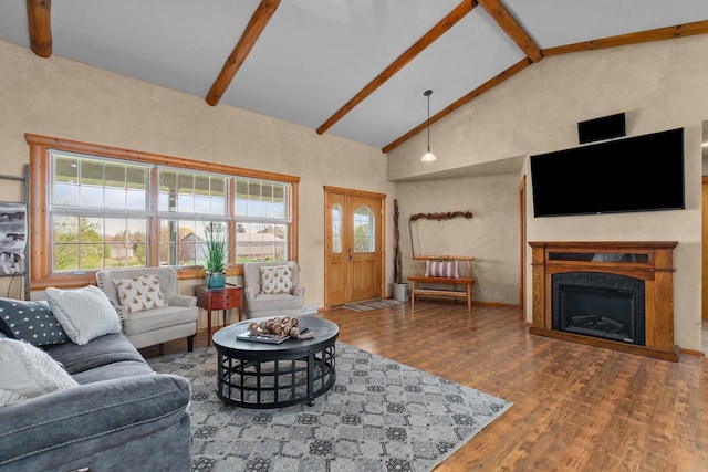 W3161 Julianna Ct, Chilton, WI 53014 - living room with beamed ceiling, wood finished floors, a premium fireplace, and high vaulted ceiling