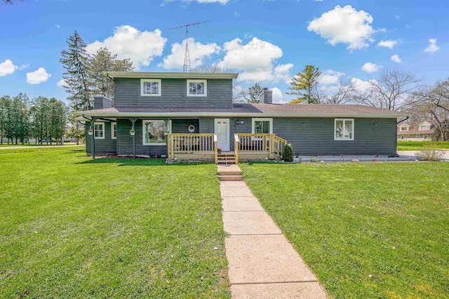 3877 Apple Ln, Oshkosh, WI 54902 - view of front of property featuring a front lawn, a chimney, and a porch