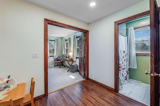 3877 Apple Ln, Oshkosh, WI 54902 - hallway featuring baseboards, wood finished floors, and an office area