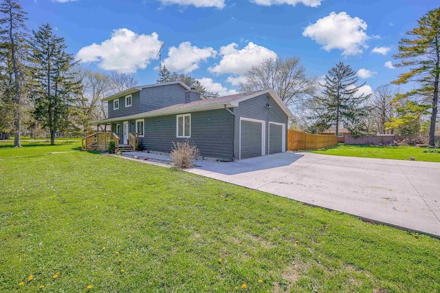 3877 Apple Ln, Oshkosh, WI 54902 - view of property exterior featuring an attached garage and driveway