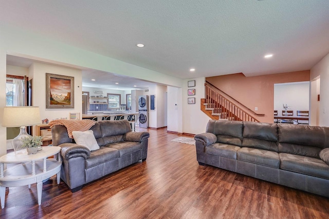3877 Apple Ln, Oshkosh, WI 54902 - living area with stacked washer and clothes dryer, wood finished floors, recessed lighting, stairs, and a textured ceiling