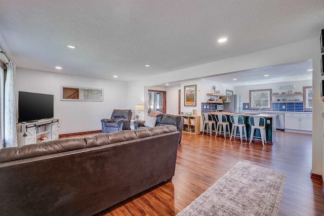 3877 Apple Ln, Oshkosh, WI 54902 - living room with a textured ceiling, wood finished floors, and recessed lighting
