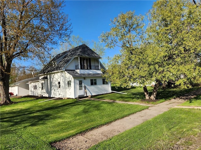 509 W Front St, Withee, WI 54498 - view of property exterior featuring a lawn