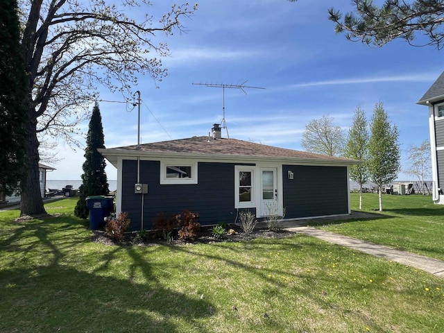 N8432 Minawa Beach Rd, Fond Du Lac, WI 54937 - view of front of home featuring a front lawn and a chimney