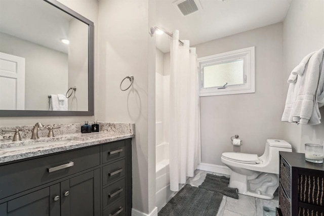 N8432 Minawa Beach Rd, Fond Du Lac, WI 54937 - full bath with toilet, marble look tile flooring, vanity, baseboards, and shower / bath combination with curtain