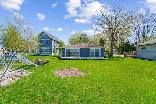 N8432 Minawa Beach Rd, Fond Du Lac, WI 54937 - back of property featuring a lawn
