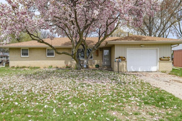 2334 W Custer Ave, Glendale, WI 53209 - single story home with an attached garage, brick siding, and driveway