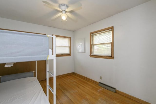 2334 W Custer Ave, Glendale, WI 53209 - unfurnished bedroom with light wood-style floors, baseboards, and ceiling fan