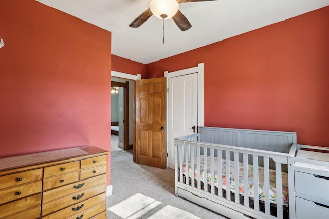 114 E Washington St, West Bend, WI 53095 - bedroom featuring carpet floors, ceiling fan, and a closet