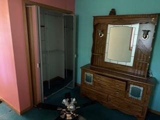interior space with baseboards and carpet flooring