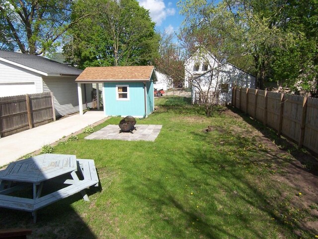 929 Park Ave, Beloit, WI 53511 - view of yard with an outdoor fire pit, an outdoor structure, and a patio