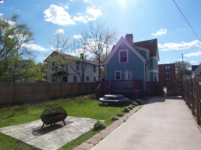 929 Park Ave, Beloit, WI 53511 - view of yard with a wooden deck, an outdoor fire pit, and a patio area