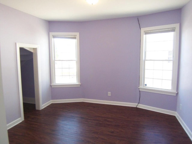 929 Park Ave, Beloit, WI 53511 - spare room featuring dark wood finished floors and baseboards