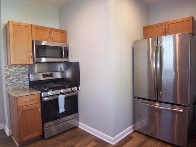929 Park Ave, Beloit, WI 53511 - kitchen featuring appliances with stainless steel finishes, dark wood-style floors, and baseboards
