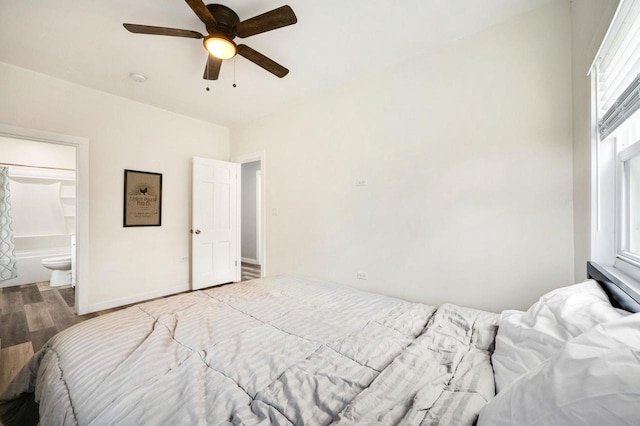 2965 S Stevenson Pier Rd, Sturgeon Bay, WI 54204 - bedroom featuring wood finished floors, baseboards, ceiling fan, and ensuite bath