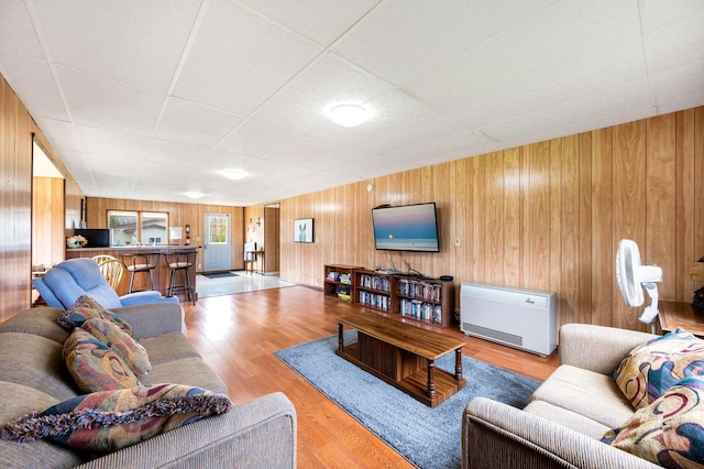 2965 S Stevenson Pier Rd, Sturgeon Bay, WI 54204 - living area featuring wood finished floors, wooden walls, and a paneled ceiling