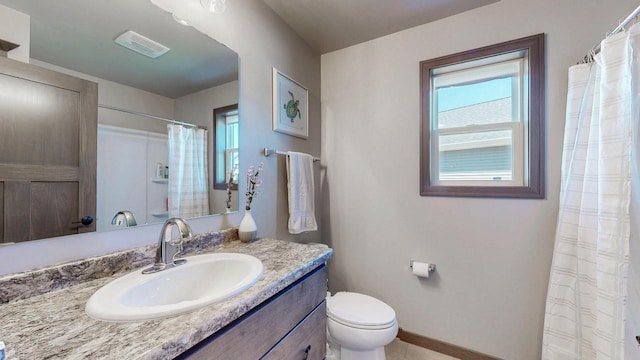 2239 E Honeygold Ct, Appleton, WI 54913 - full bathroom featuring baseboards, toilet, vanity, and tile patterned flooring