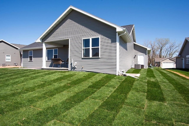 2239 E Honeygold Ct, Appleton, WI 54913 - back of house with a yard and cooling unit