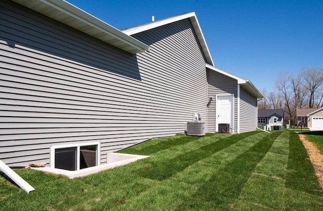 2239 E Honeygold Ct, Appleton, WI 54913 - view of property exterior featuring a lawn and central air condition unit