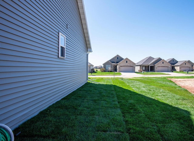 2239 E Honeygold Ct, Appleton, WI 54913 - view of green lawn featuring a residential view, a garage, and driveway