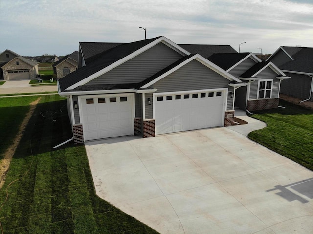 2239 E Honeygold Ct, Appleton, WI 54913 - view of front of property featuring brick siding, driveway, an attached garage, and a front yard
