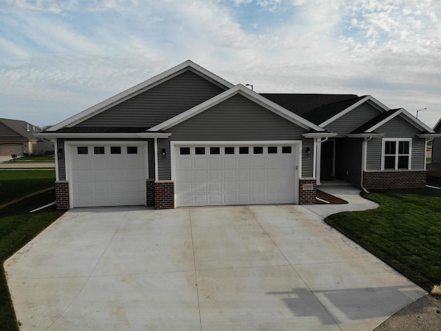 2239 E Honeygold Ct, Appleton, WI 54913 - view of front of home with brick siding, driveway, an attached garage, and a front lawn