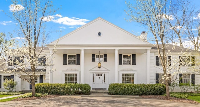 2305 W County Line Rd, River Hills, WI 53217 - greek revival inspired property with a chimney and stucco siding
