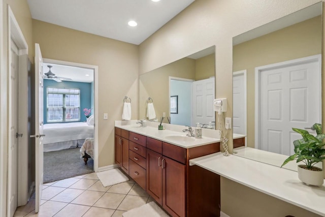 670 E Lake Ave Unit 202, Wisconsin Dells, WI 53940 - ensuite bathroom with double vanity, tile patterned flooring, and recessed lighting