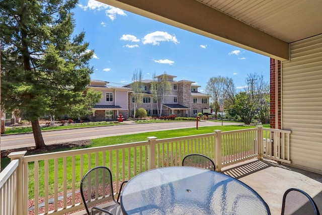 670 E Lake Ave Unit 202, Wisconsin Dells, WI 53940 - balcony with covered porch and outdoor dining space