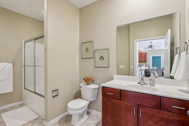 670 E Lake Ave Unit 202, Wisconsin Dells, WI 53940 - ensuite bathroom featuring vanity, ceiling fan, toilet, baseboards, and tile patterned flooring