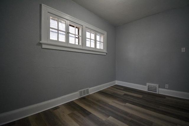 2625 N 50th St, Milwaukee, WI 53210 - unfurnished room featuring baseboards and dark wood finished floors