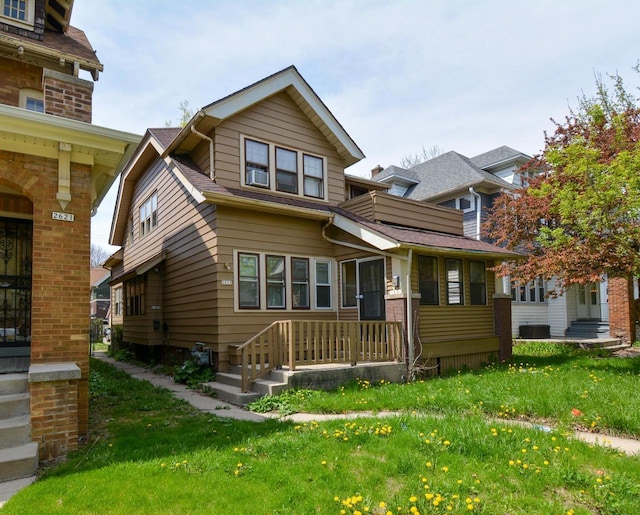 2625 N 50th St, Milwaukee, WI 53210 - view of front of house featuring a front lawn and cooling unit