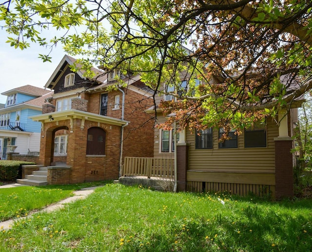 2625 N 50th St, Milwaukee, WI 53210 - view of front of home with brick siding and a front lawn