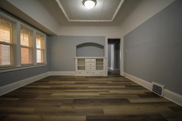 2625 N 50th St, Milwaukee, WI 53210 - empty room with a tray ceiling, baseboards, and dark wood-style floors