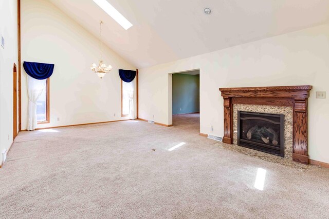 8200 43rd Ave, Kenosha, WI 53142 - unfurnished living room with a chandelier, carpet, lofted ceiling, a skylight, and a fireplace